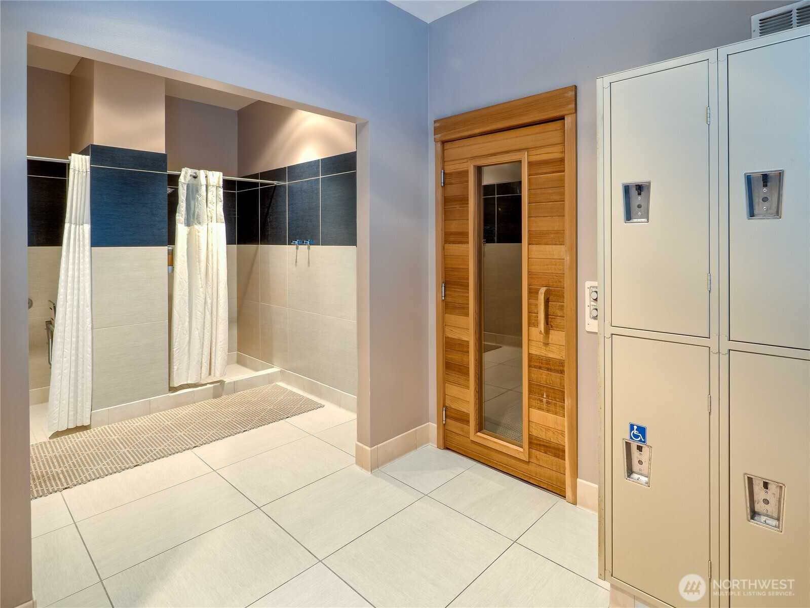 910 Lenora Street, Unit 200 Seattle, WA 98121 - Photo 21 of 23 a view of a hallway with a bathroom
