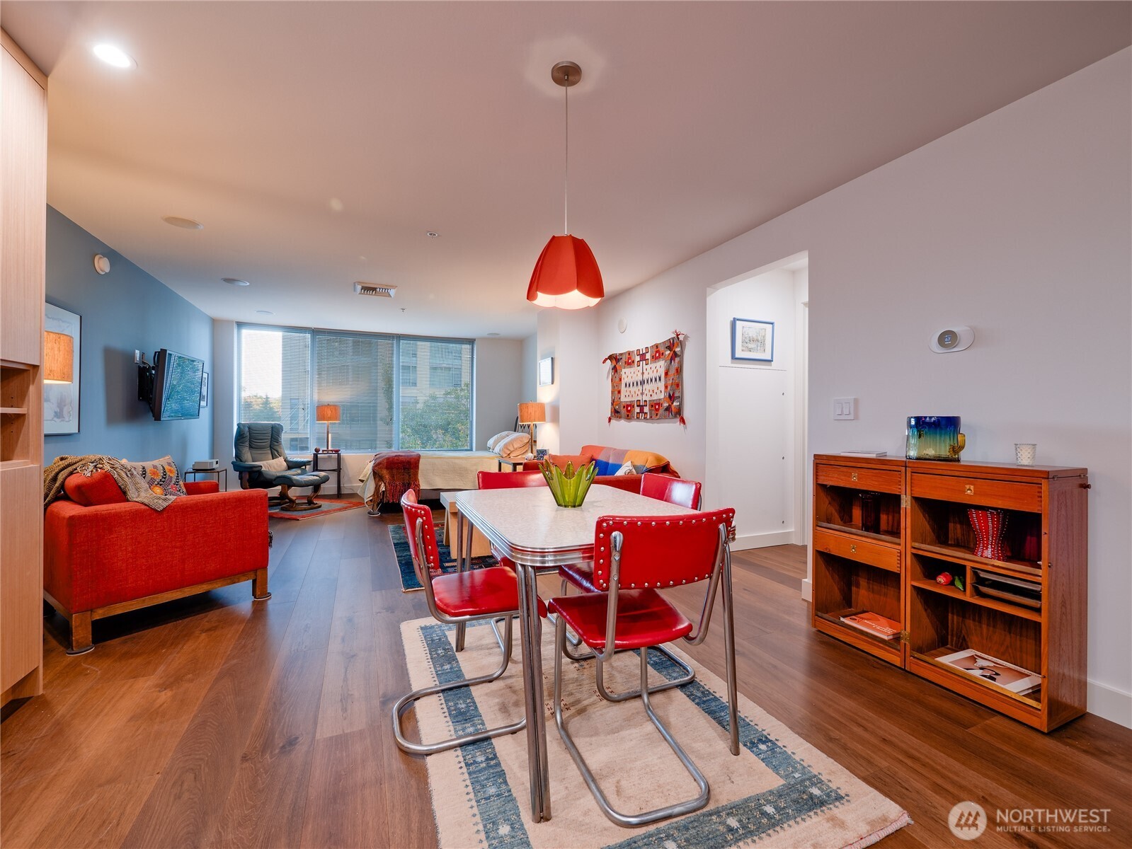 910 Lenora Street, Unit 200 Seattle, WA 98121 - Photo 7 of 23 a living room with furniture a rug and a window