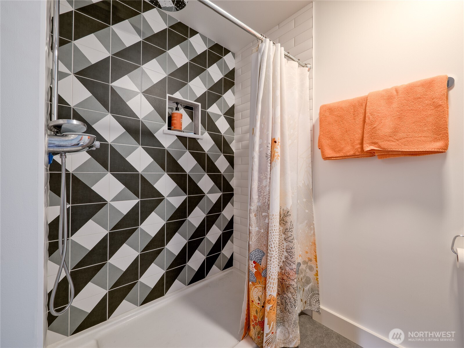910 Lenora Street, Unit 200 Seattle, WA 98121 - Photo 9 of 23 a view of walk in closet with clothes and shoes