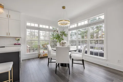 a view of living room with furniture and wooden floor