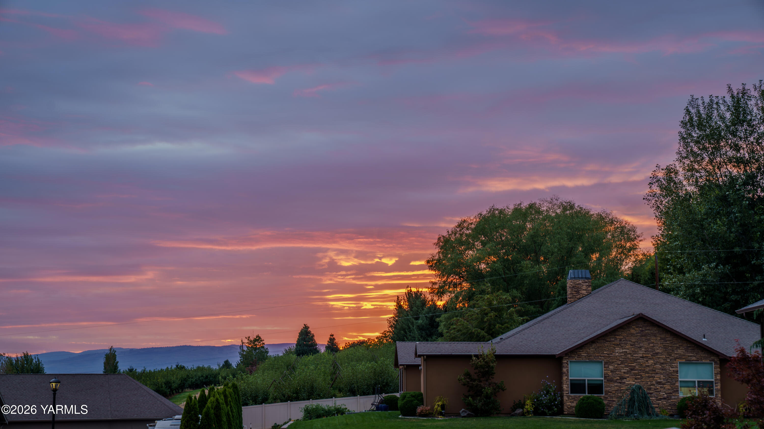 304 Rainier Street Yakima, WA 98908 - Photo 12 of 39 a view of a house with a yard and a street