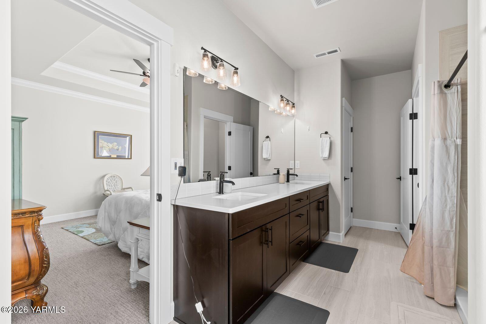 304 Rainier Street Yakima, WA 98908 - Photo 31 of 39 a spacious bathroom with a double vanity sink mirror and toilet