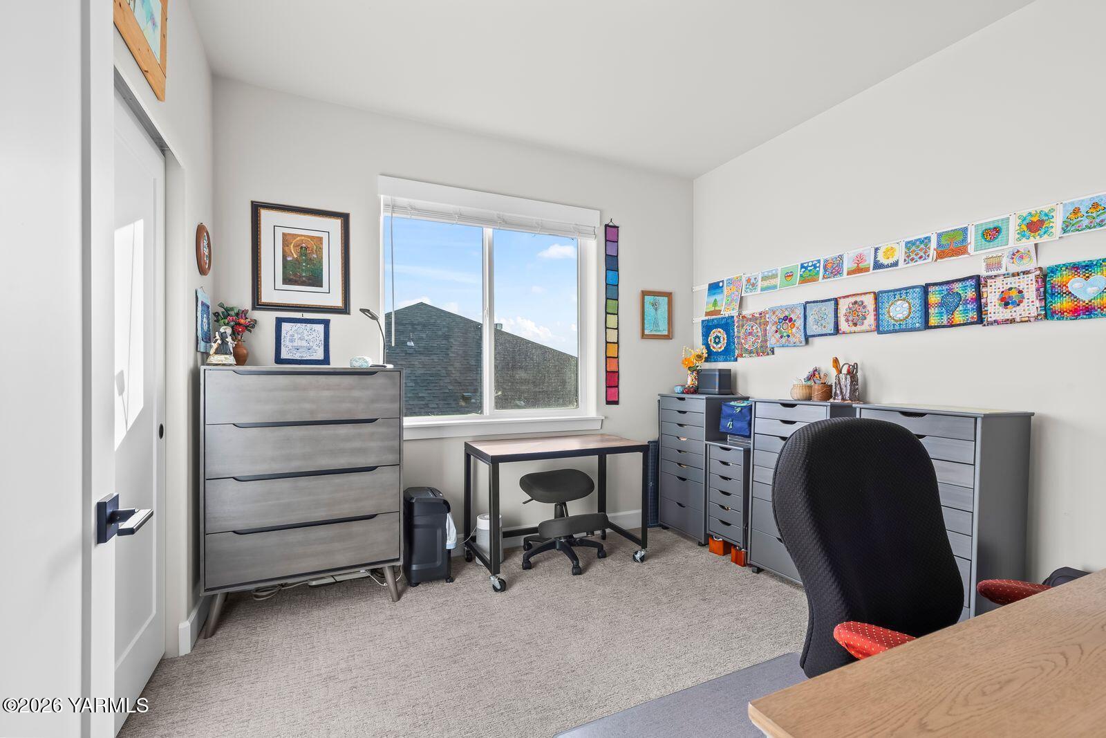 304 Rainier Street Yakima, WA 98908 - Photo 35 of 39 a view of a workspace with furniture and a window