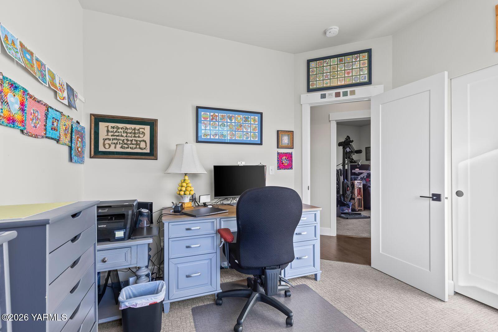 304 Rainier Street Yakima, WA 98908 - Photo 36 of 39 a view of a workspace with furniture and a bedroom