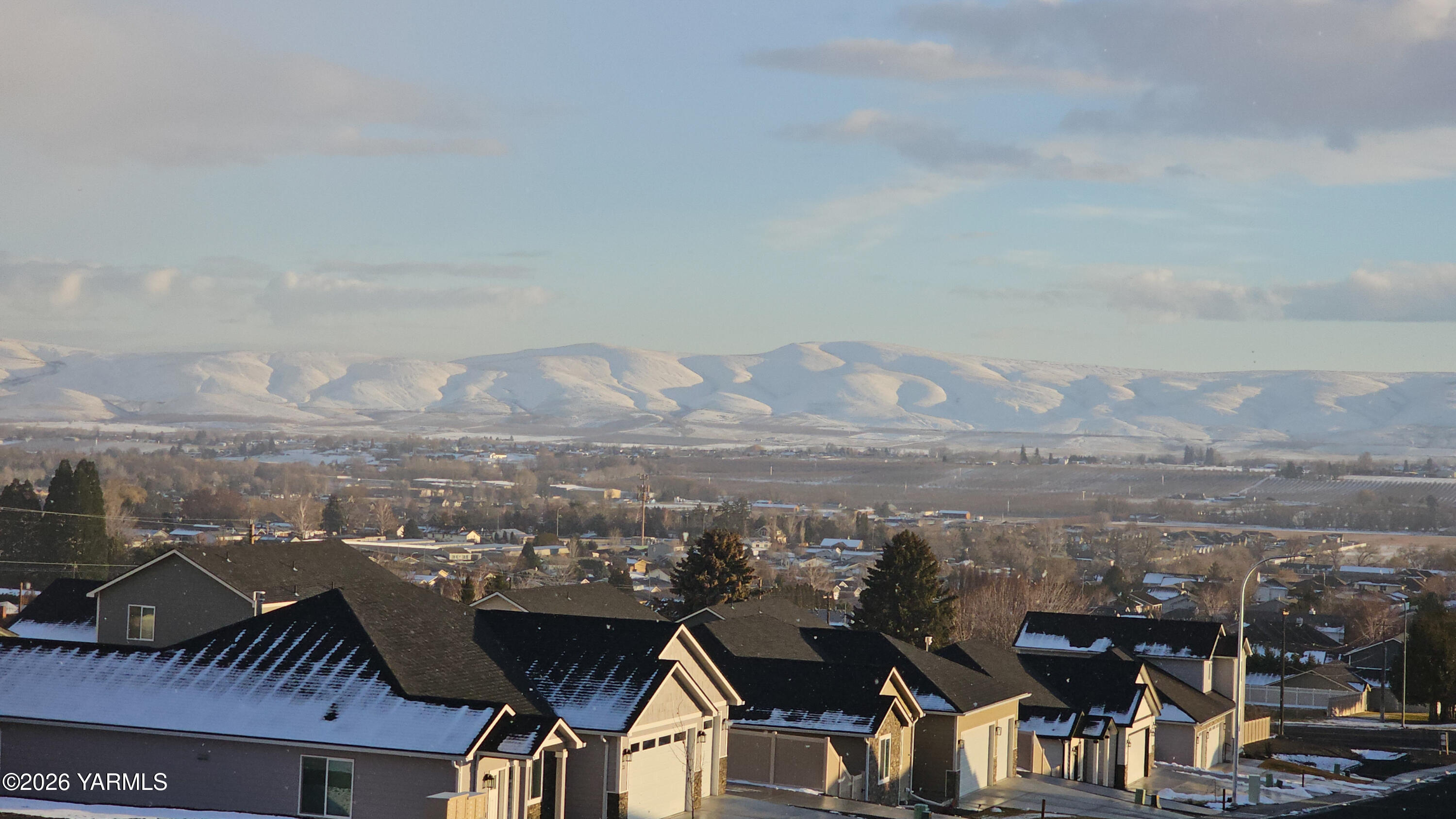 304 Rainier Street Yakima, WA 98908 - Photo 5 of 39 a view of a city with tall buildings in the background