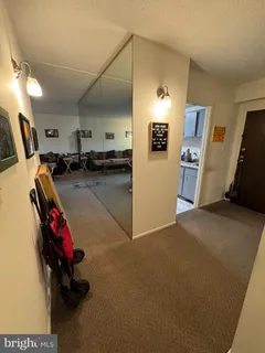 a view of a livingroom with furniture and a flat screen tv