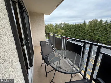 a view of balcony with furniture