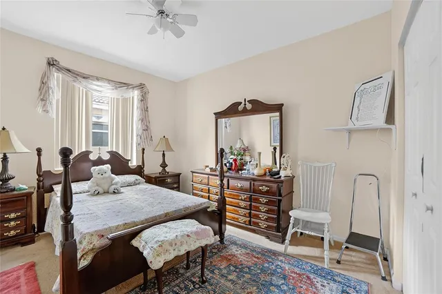 a view of a dining room with furniture and a chandelier