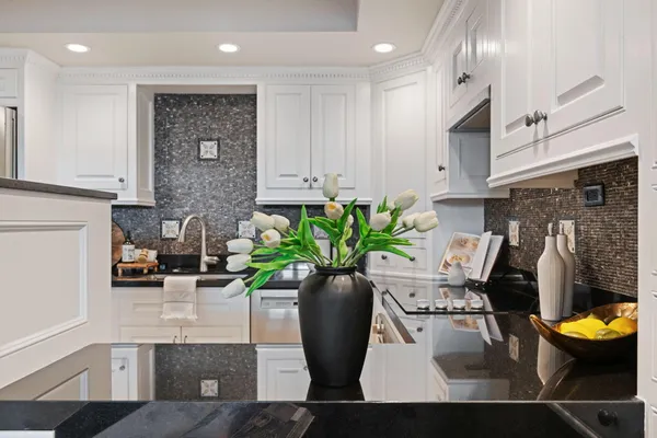a view of a living room with furniture and a potted plant