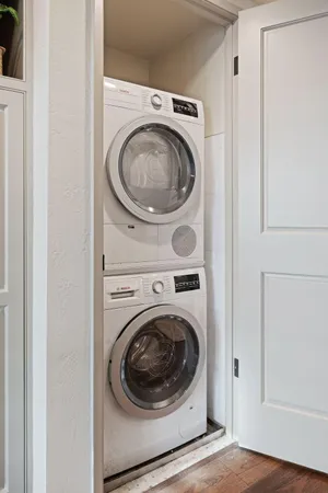a view of a hallway with washer and dryer