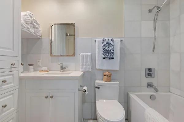 a bathroom with a sink toilet and vanity