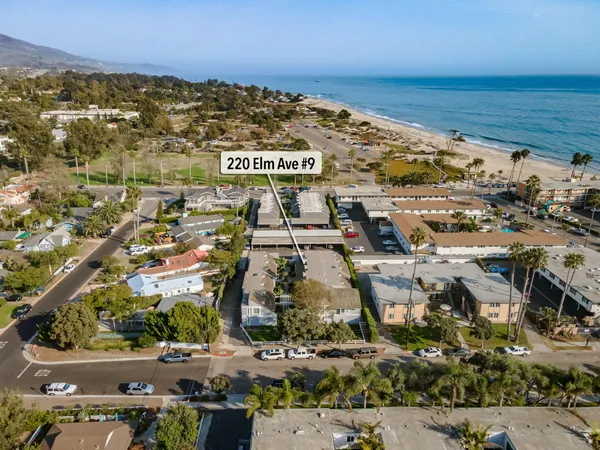 an aerial view of residential building and ocean