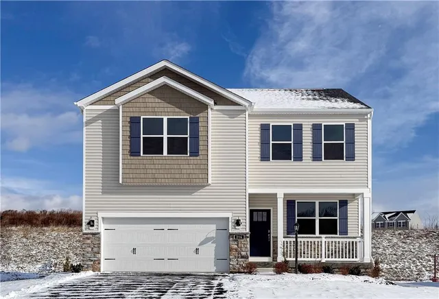 a view of a dining room with furniture and a book shelf
