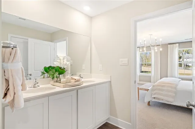 a white toilet sitting next to a bathroom sink