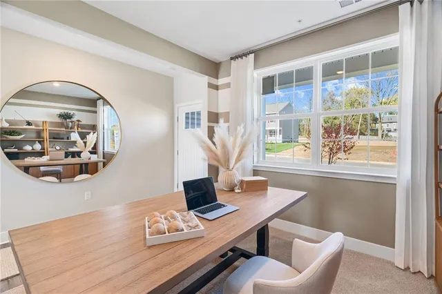 a view of a workspace with furniture