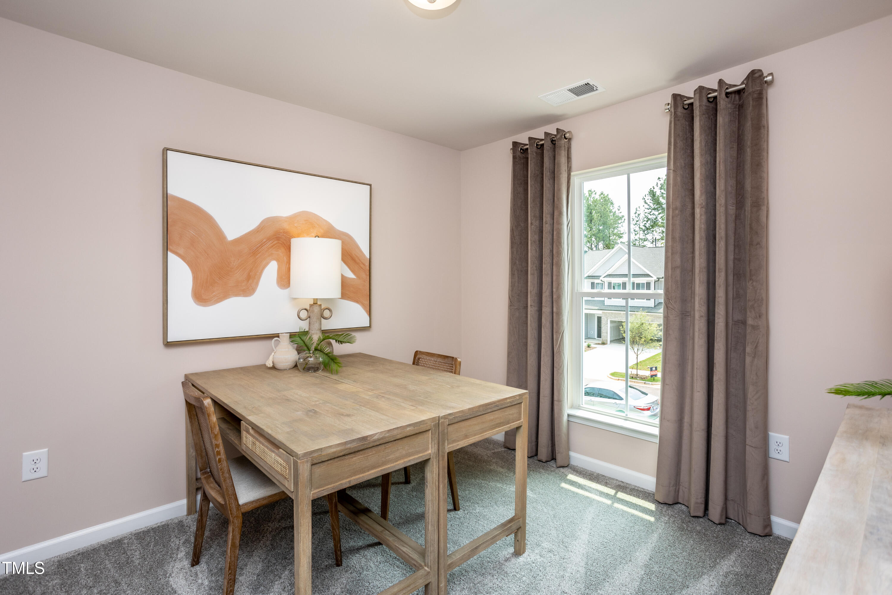 242 Broomside Avenue Raleigh, NC 27603 - Photo 13 of 22 a dining room with furniture and window