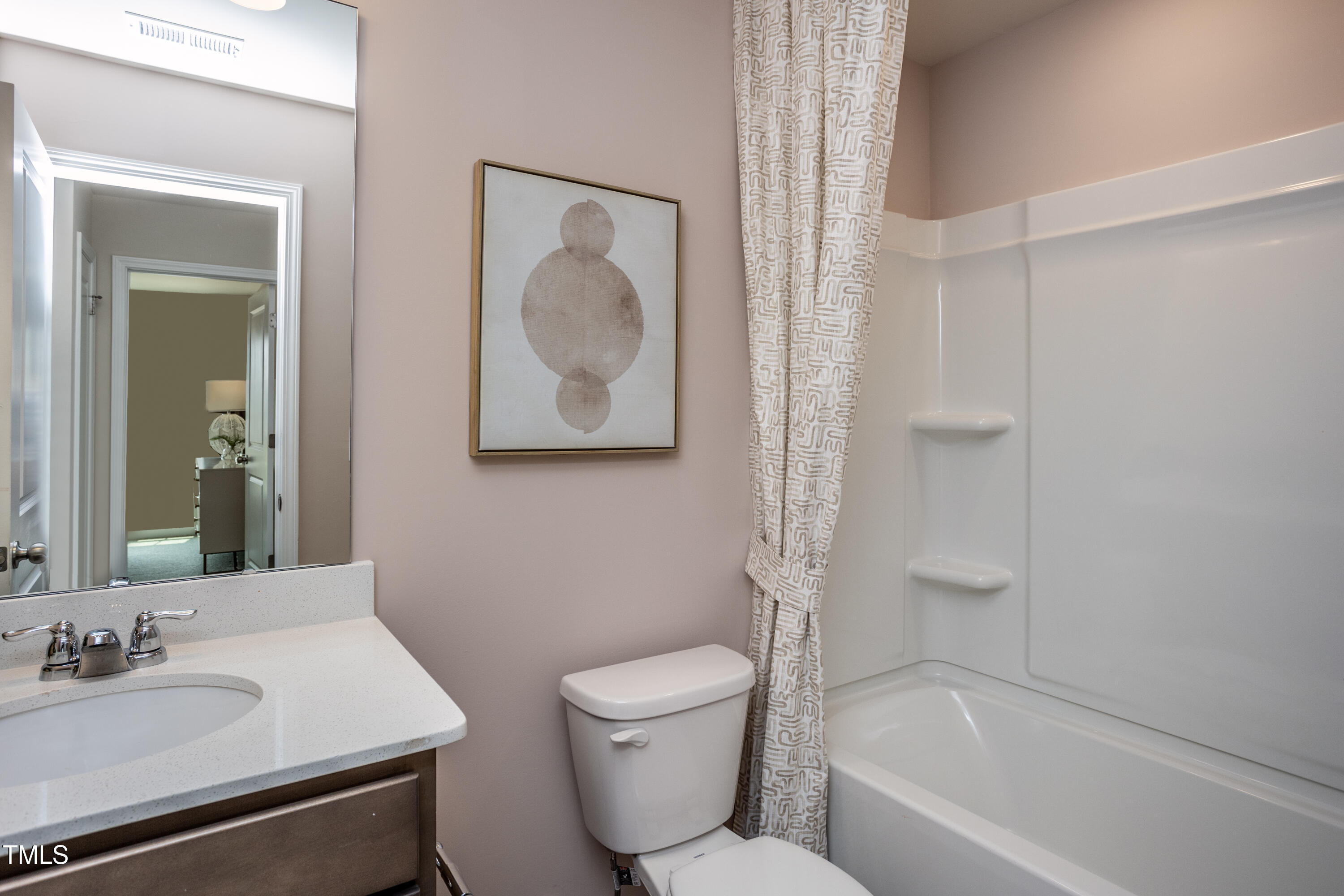 242 Broomside Avenue Raleigh, NC 27603 - Photo 14 of 22 a bathroom with a toilet sink and mirror