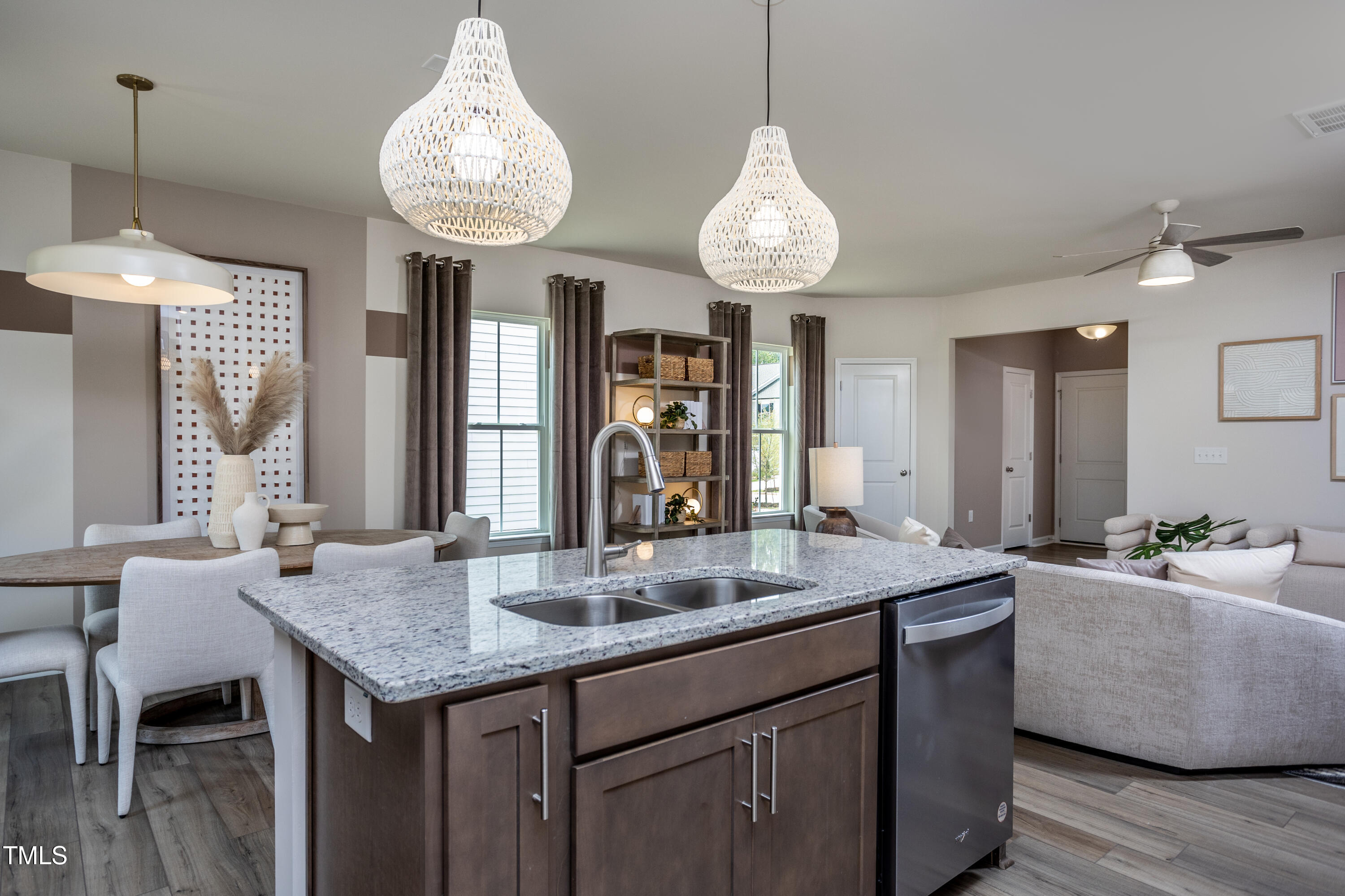 242 Broomside Avenue Raleigh, NC 27603 - Photo 4 of 22 a view of a kitchen counter space a sink and chandelier