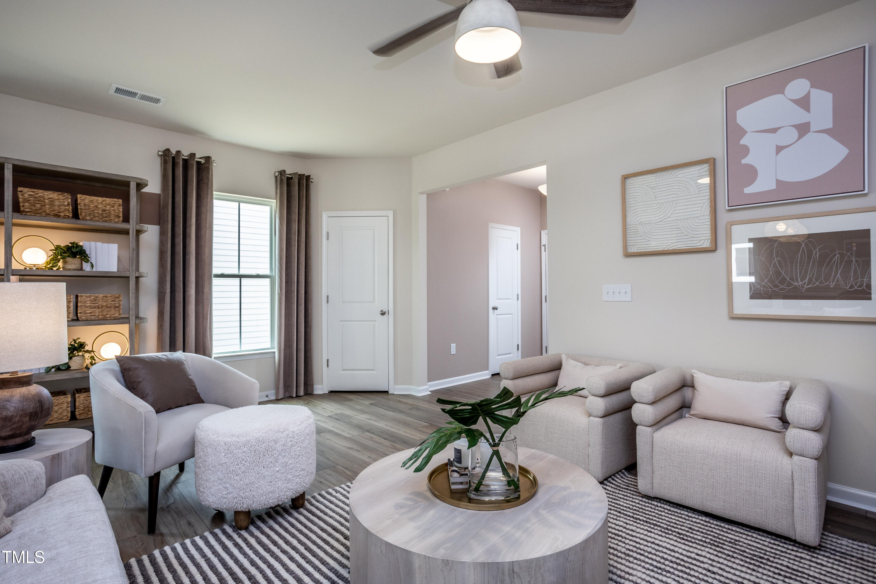 242 Broomside Avenue Raleigh, NC 27603 - Photo 6 of 22 a living room with furniture couches and a table