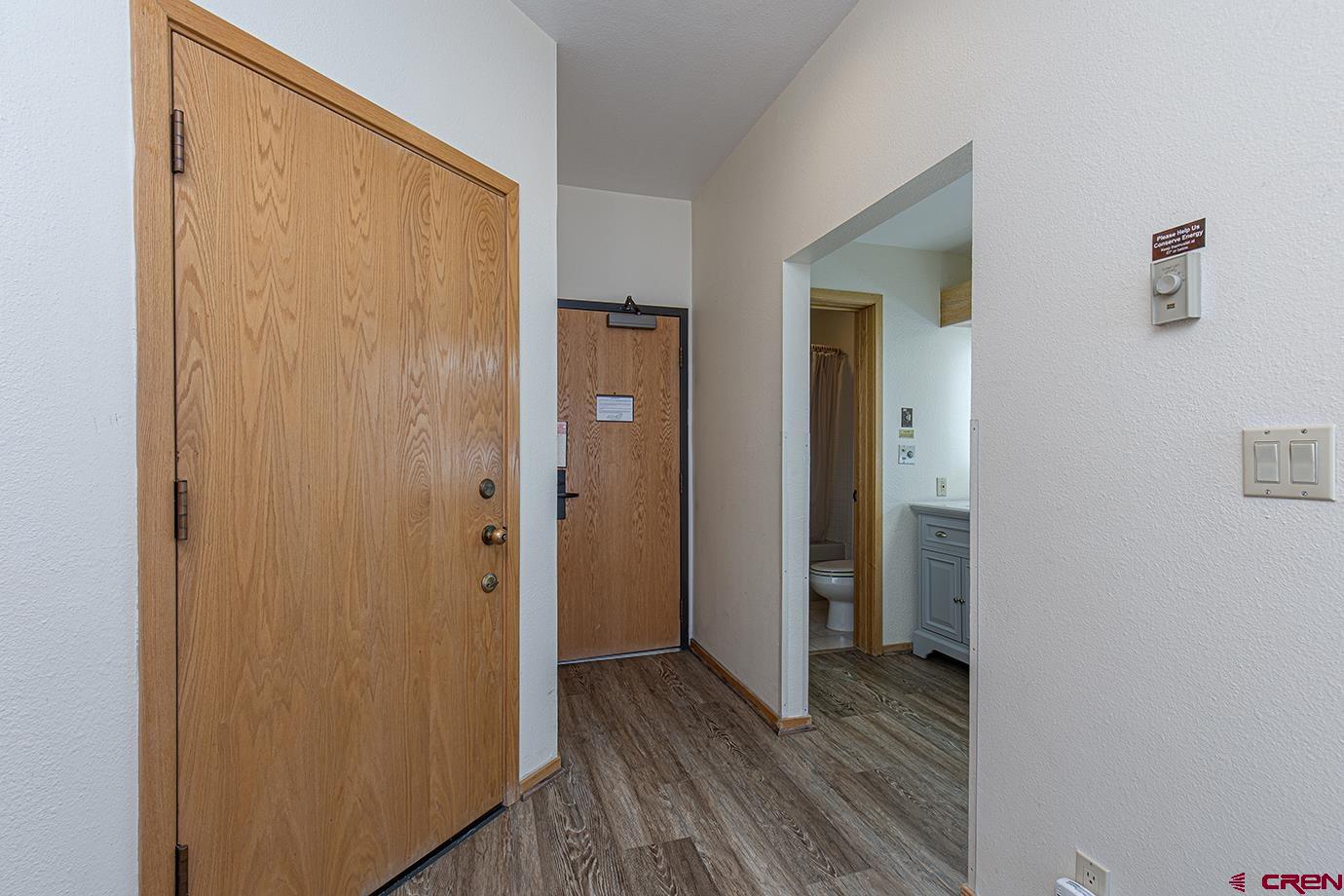 93 Needles Way, Unit 514 Durango, CO 81301 - Photo 23 of 34 a view of a hallway with wooden floor and closet
