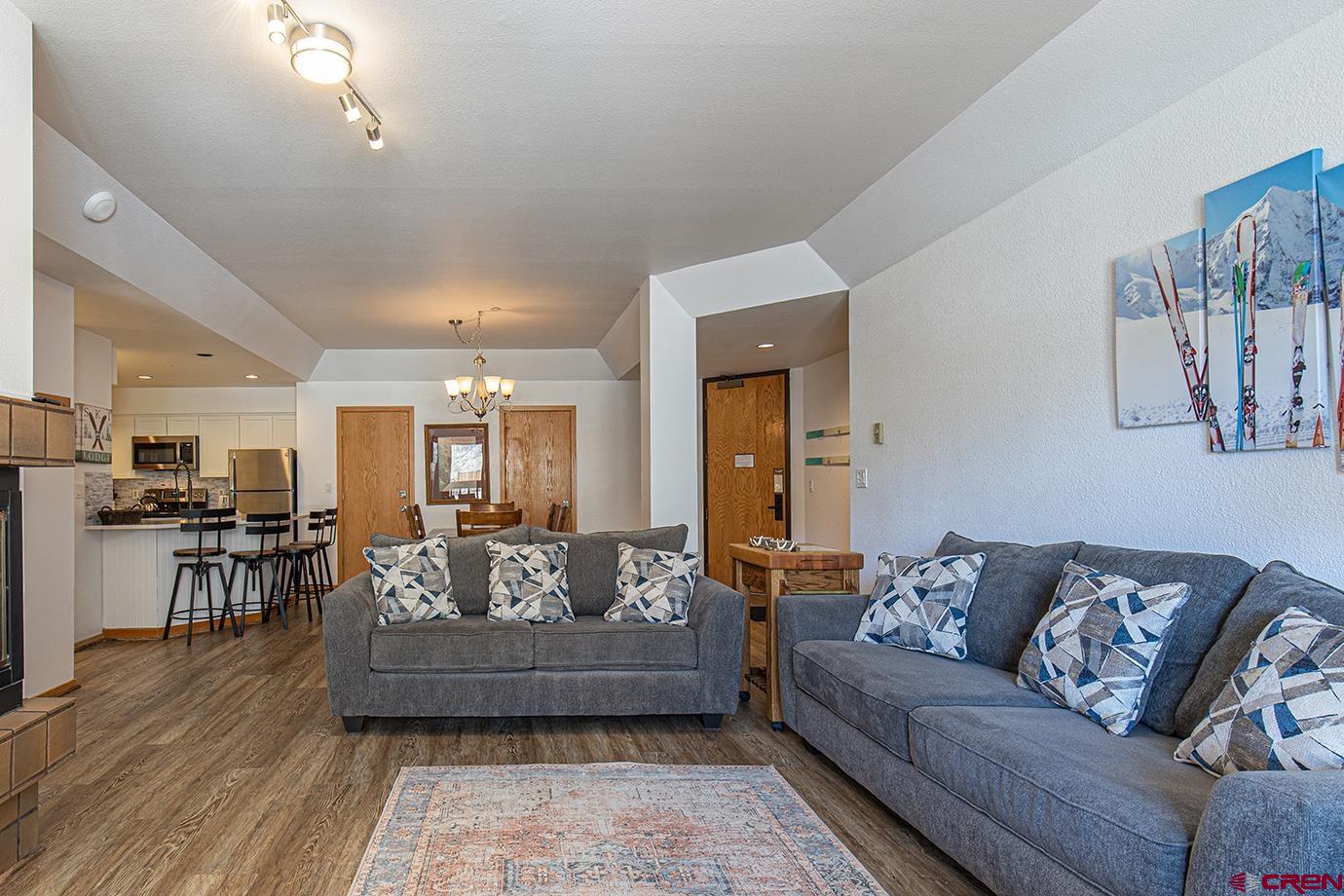 93 Needles Way, Unit 514 Durango, CO 81301 - Photo 4 of 34 a living room with furniture and view of kitchen