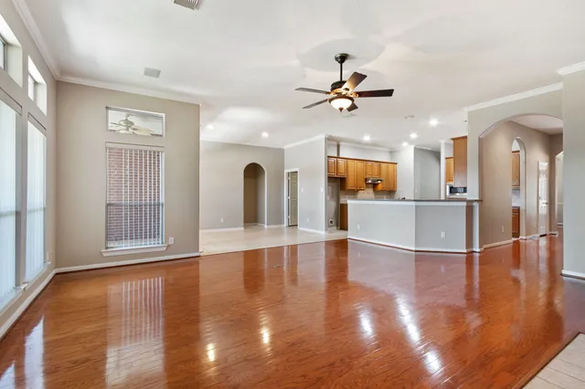 a view of a living room a window and wooden floor