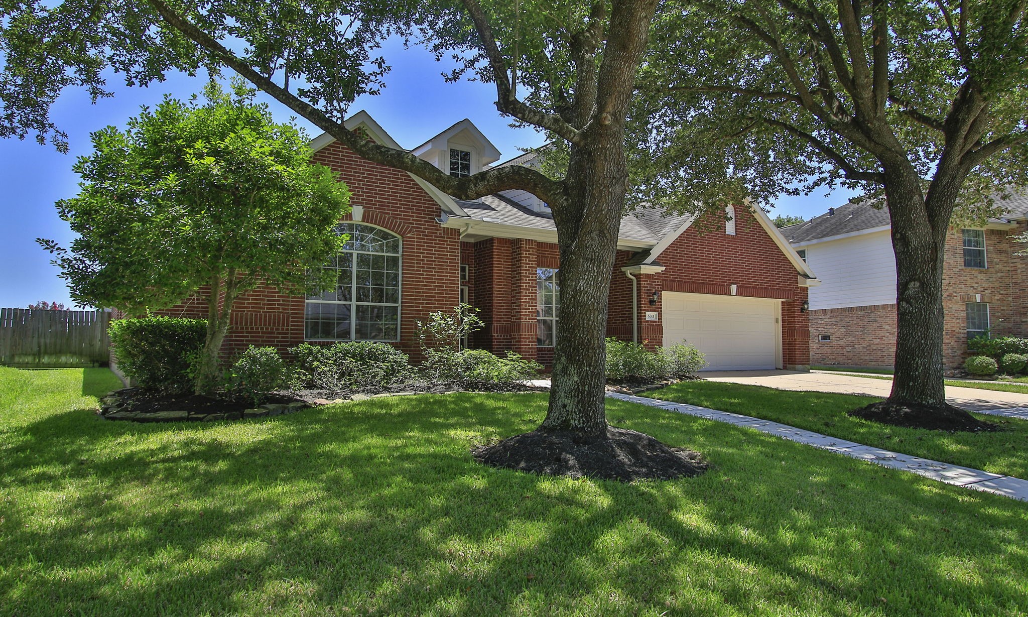 6311 Stone Trail Lane Spring, TX 77379 - Photo 2 of 47 Mature landscaping and charming architectural design creates lovely curb appeal on this 2003 Lennar home