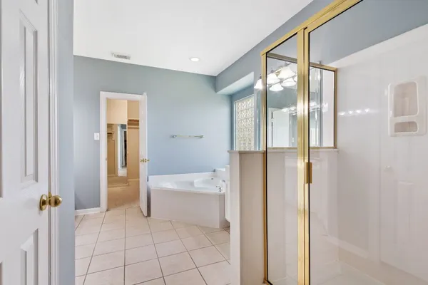 a bathroom with a sink a mirror and a bathtub