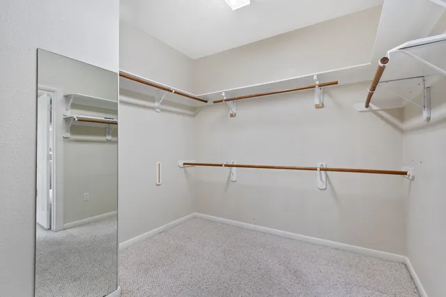 a view of an empty walk in closet