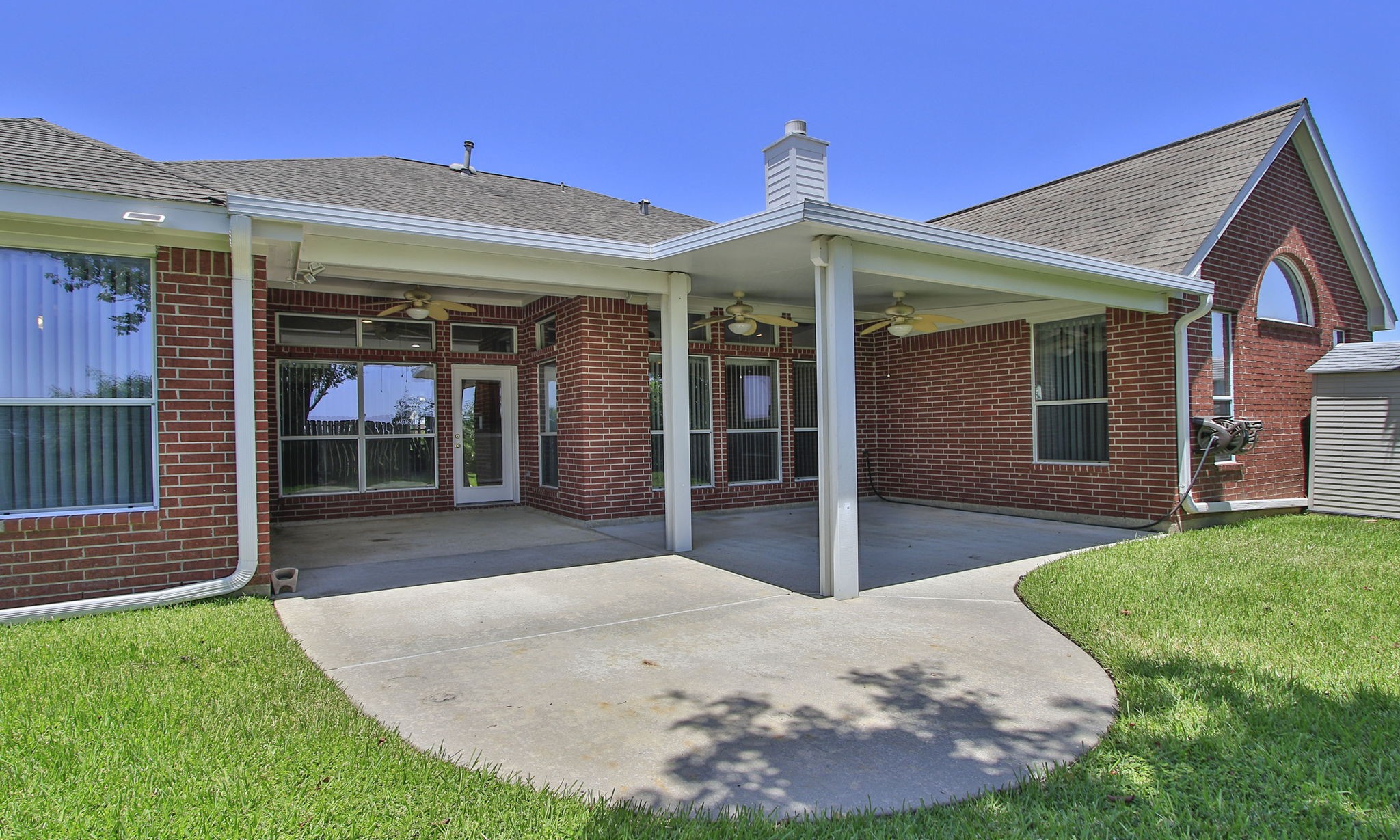 6311 Stone Trail Lane Spring, TX 77379 - Photo 32 of 47 3 ceiling fans to keep cool and extended concrete so there is plenty of room for the BBQ pit
