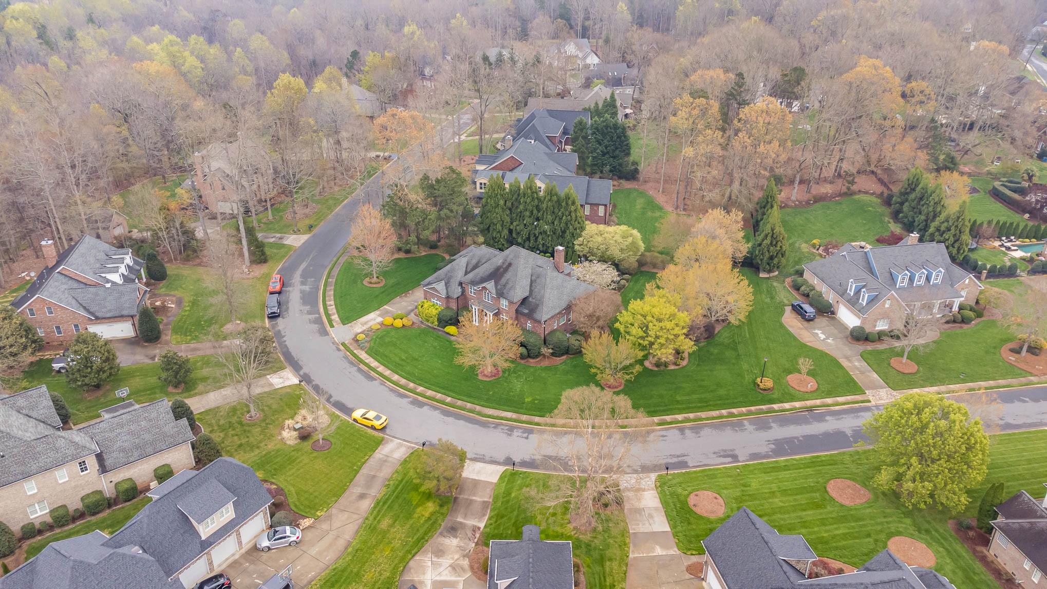 6700 Fox Ridge Circle Davidson, NC 28036 - Photo 47 of 48 an aerial view of a house with a garden and mountains