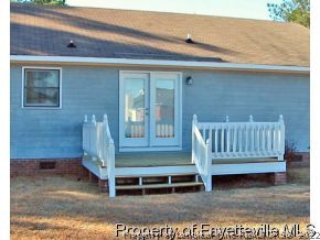 10223 Rockfish Road Raeford, NC 28376 - Photo 12 of 12 a view of deck with a table and chair