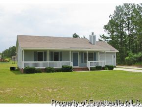 10223 Rockfish Road Raeford, NC 28376 - Photo 2 of 12 a front view of house with yard and green space