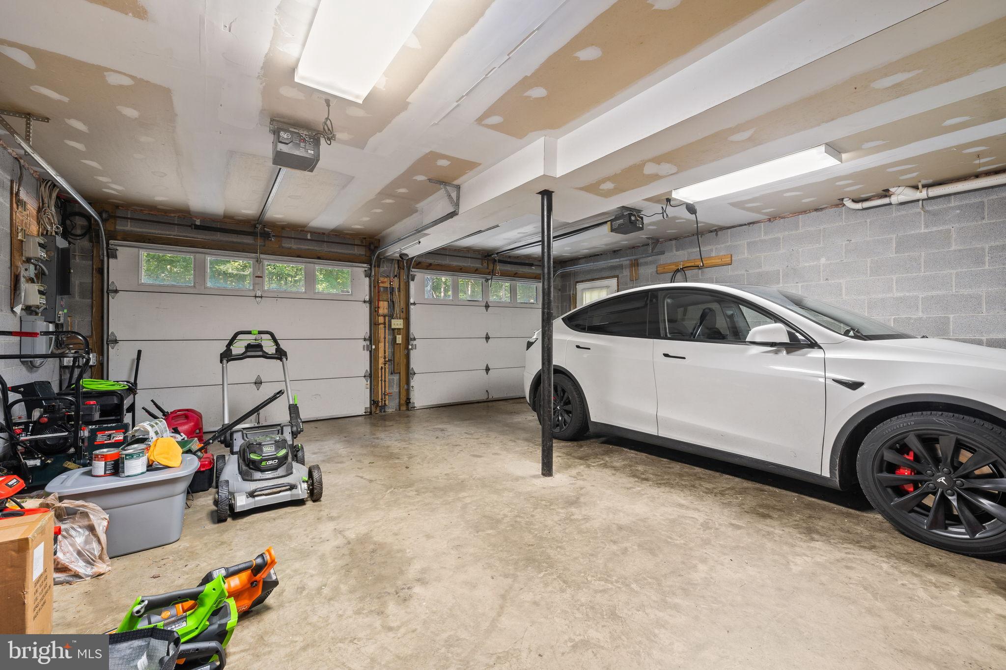 4344 Mission Road Harpers Ferry, WV 25425 - Photo 39 of 60 Spacious garage with modern electric vehicle.