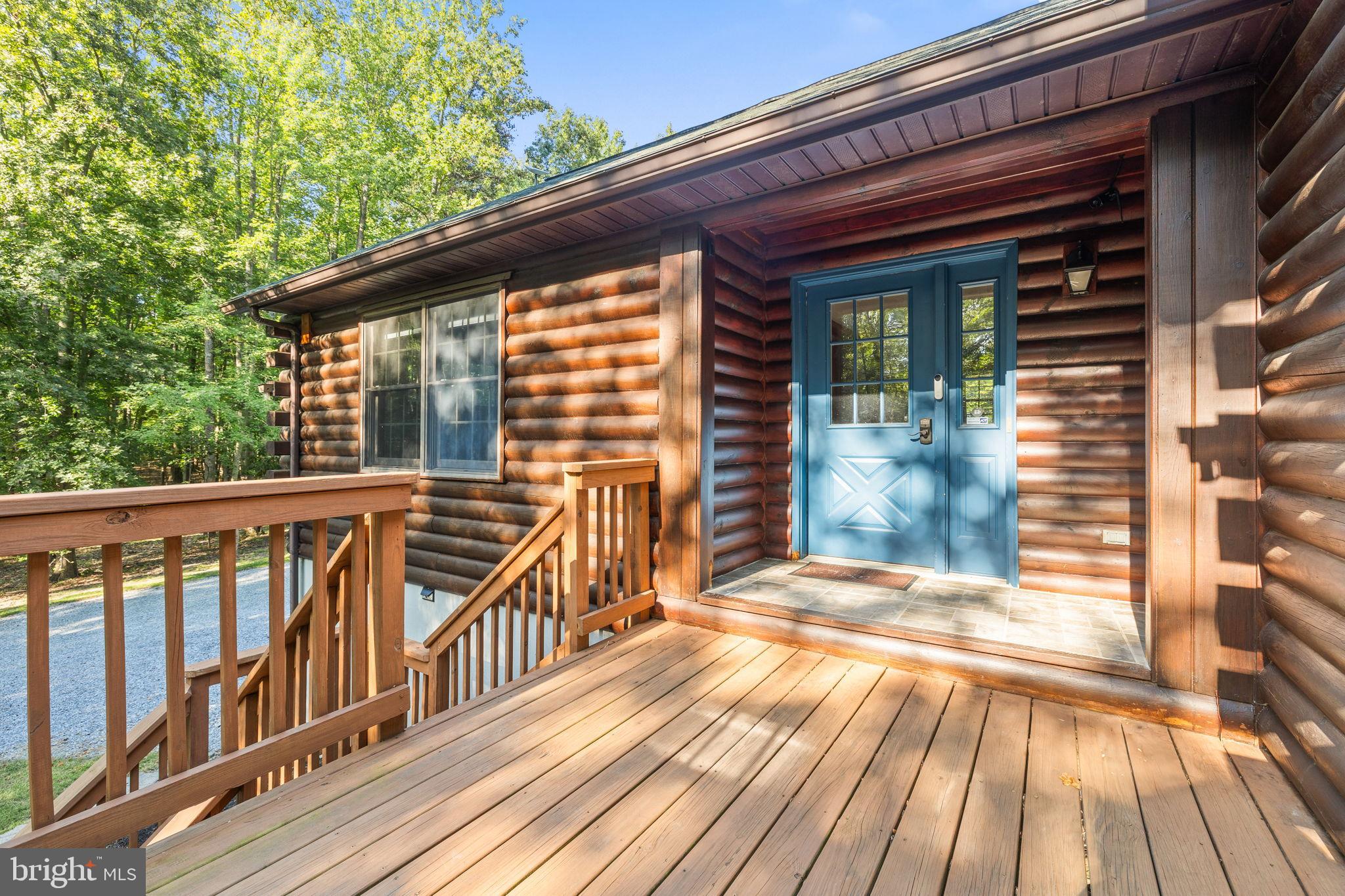 4344 Mission Road Harpers Ferry, WV 25425 - Photo 8 of 60 Charming log cabin entrance with serene views.