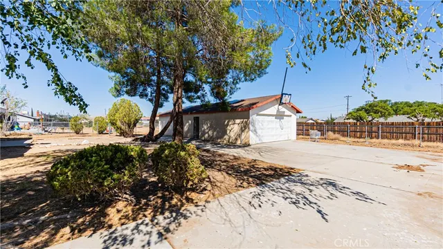 a view of a kitchen with a sink and a window