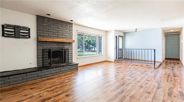 a kitchen with white cabinets and appliances