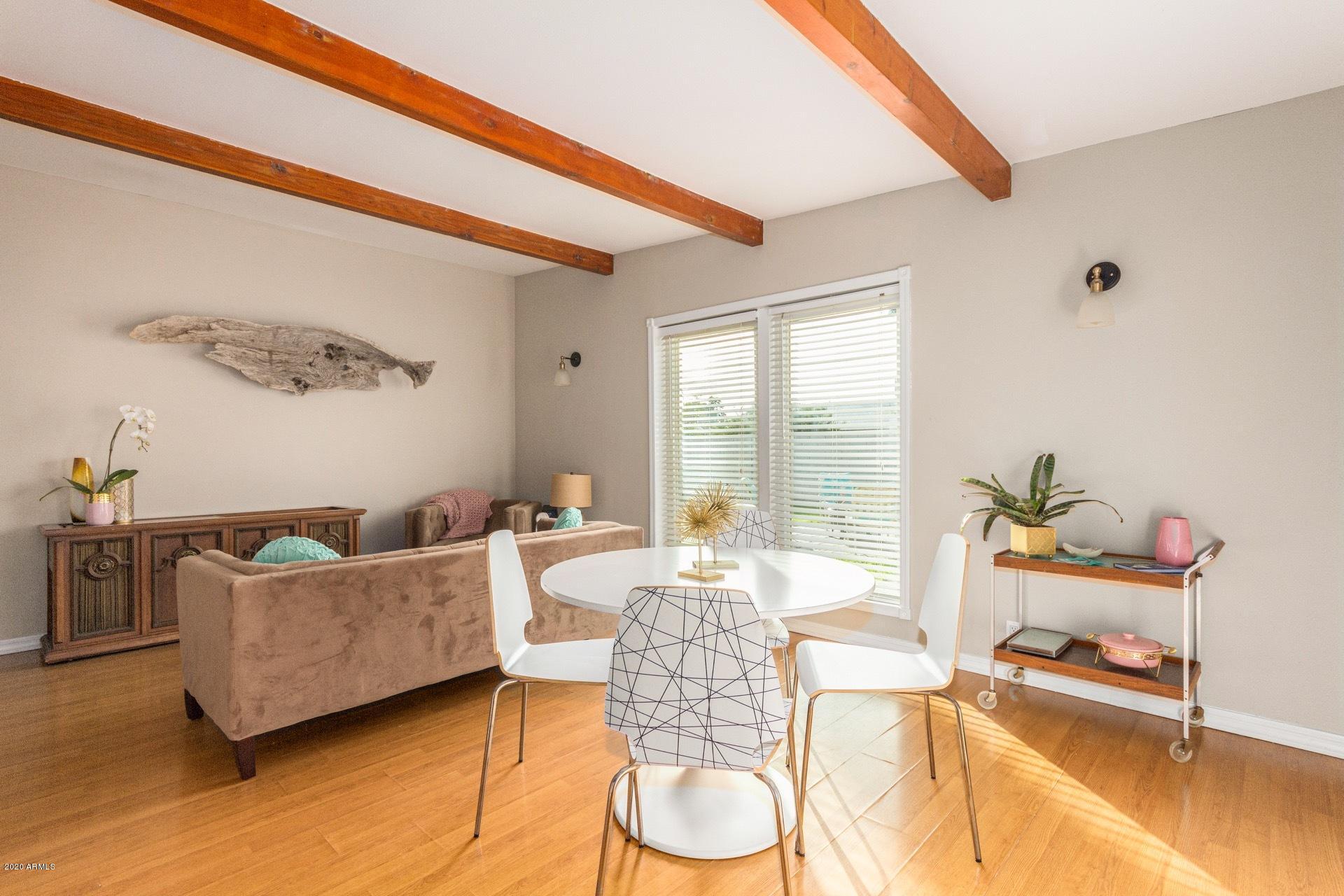 1732 North Queensbury Mesa, AZ 85201 - Photo 11 of 27 a living room with furniture and a floor to ceiling window