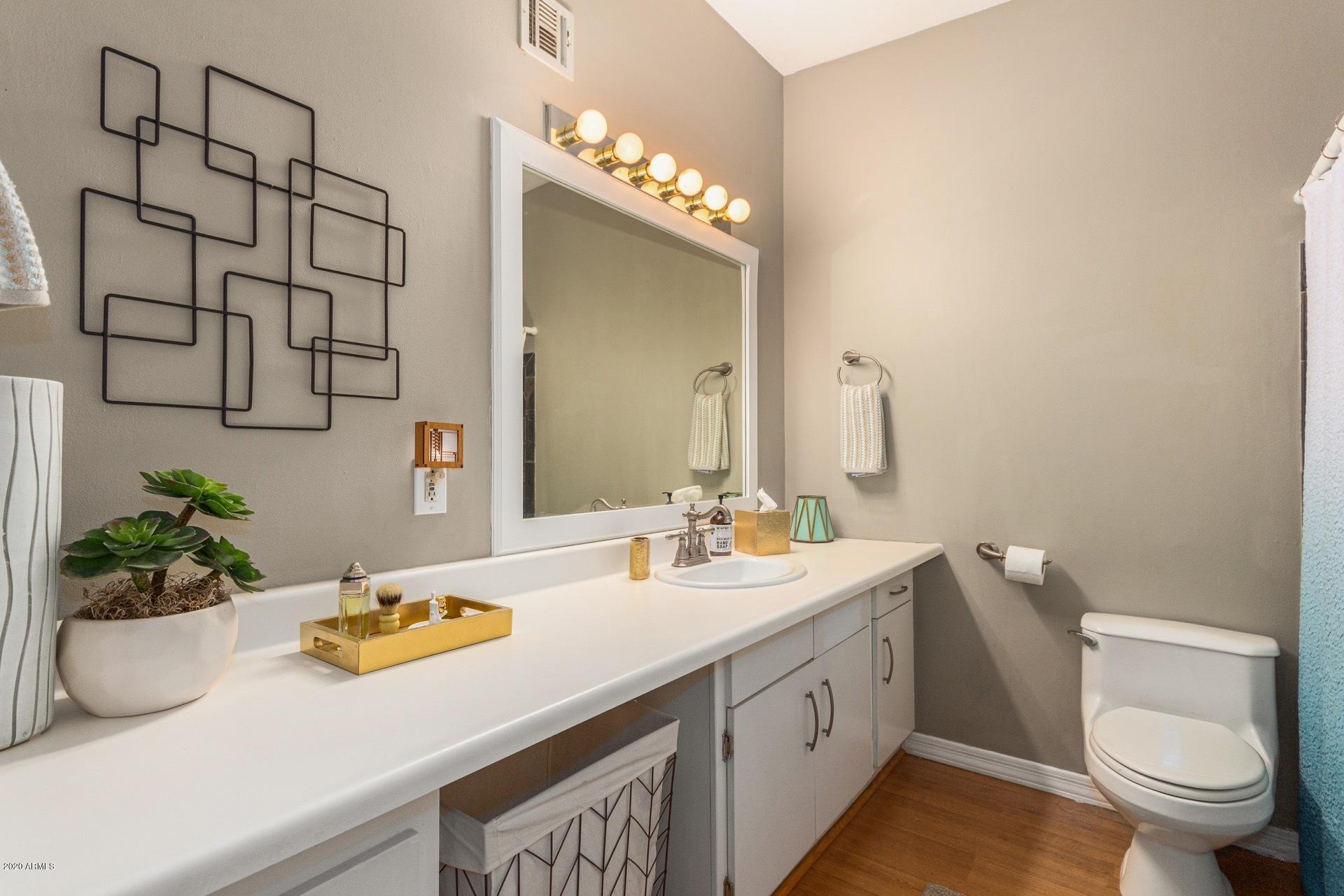 1732 North Queensbury Mesa, AZ 85201 - Photo 13 of 27 a bathroom with a sink a toilet and mirror