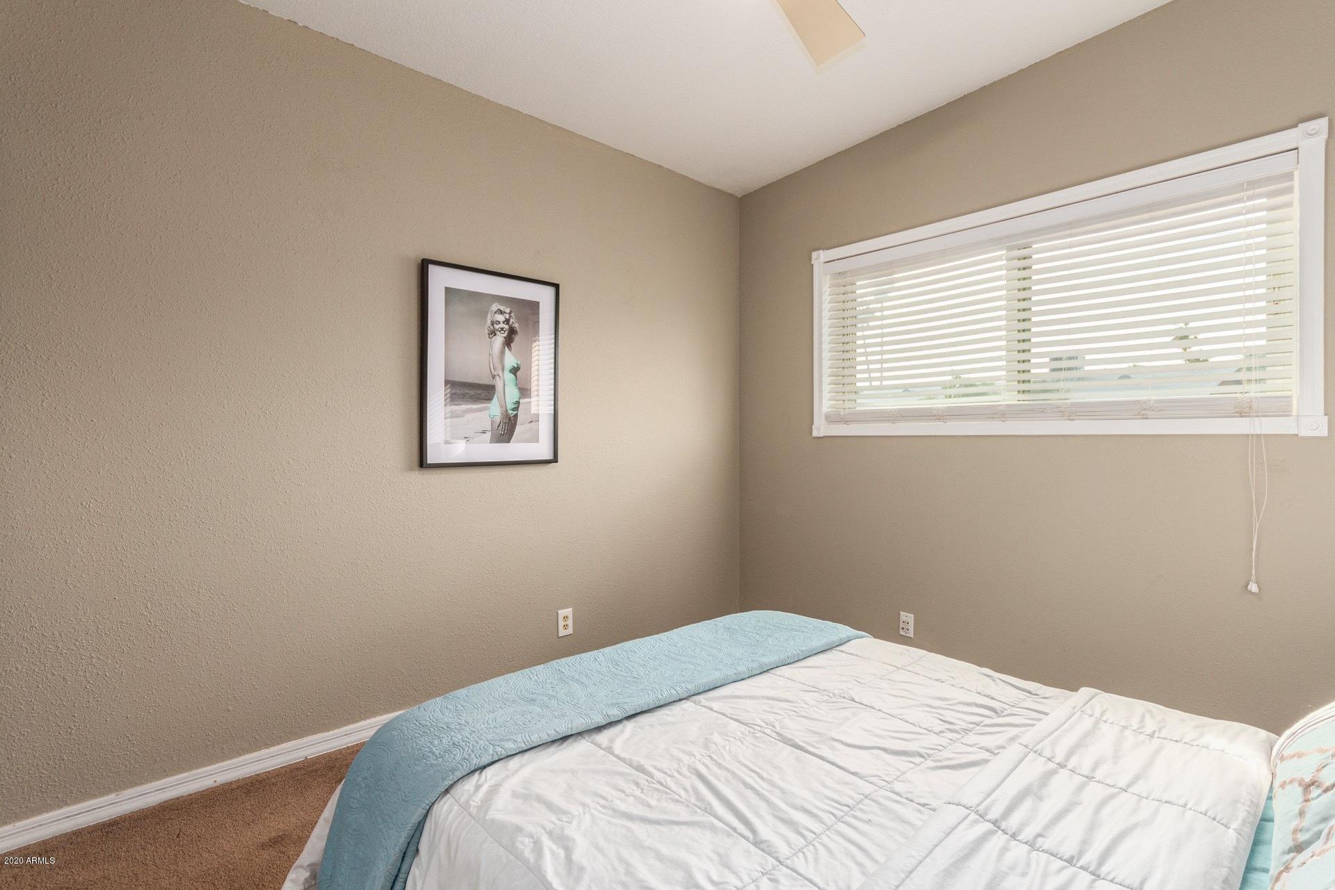 1732 North Queensbury Mesa, AZ 85201 - Photo 16 of 27 a bedroom with a bed and a window