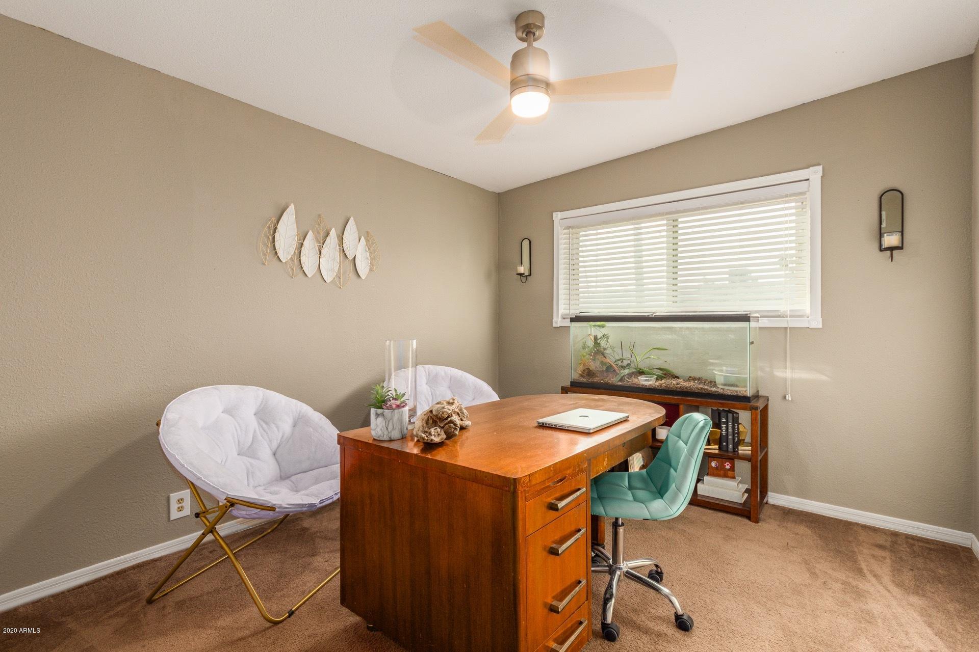 1732 North Queensbury Mesa, AZ 85201 - Photo 17 of 27 a view of a room that has a couch and a chair in it