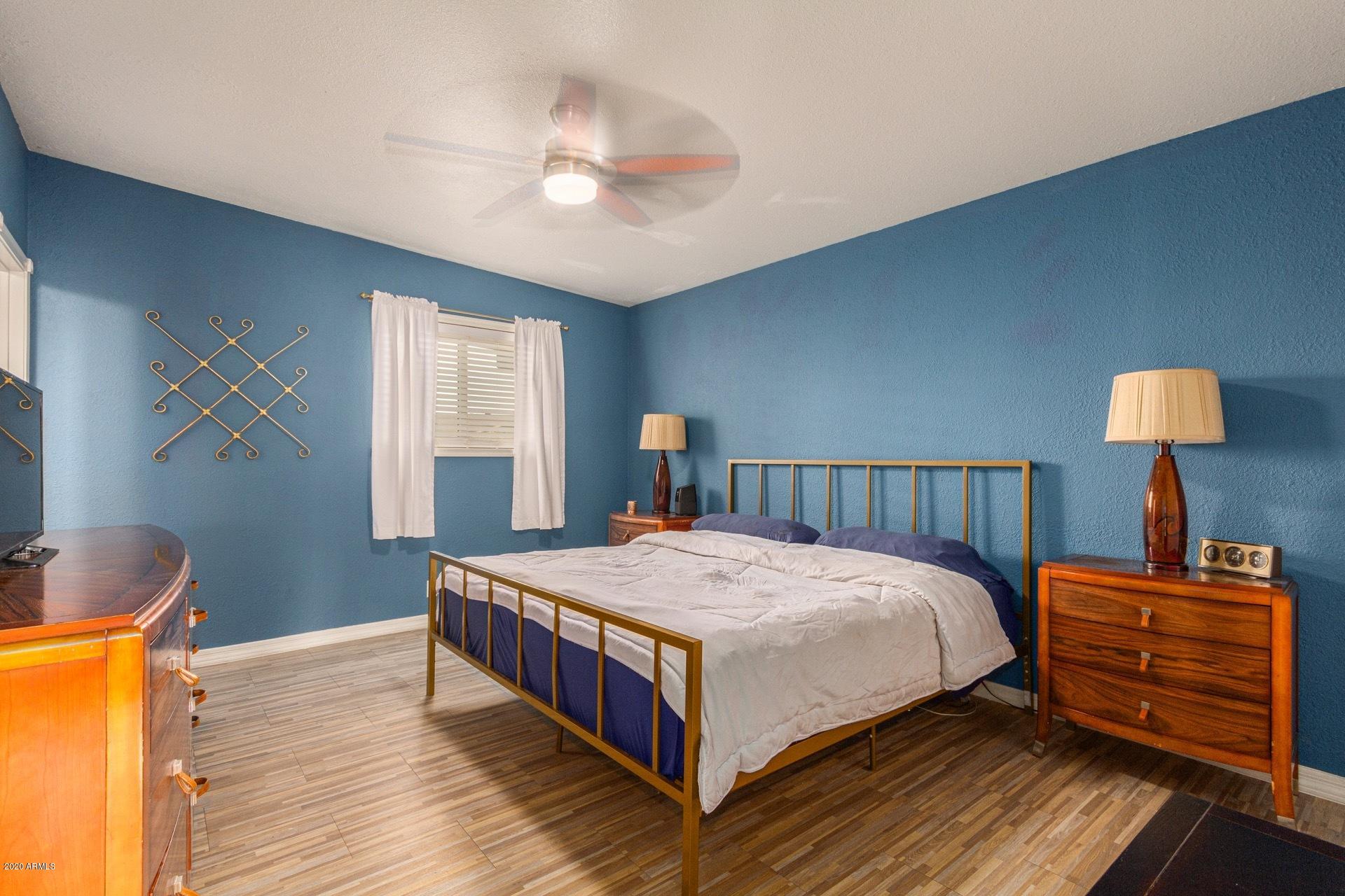 1732 North Queensbury Mesa, AZ 85201 - Photo 19 of 27 a bedroom with a bed and wooden floor