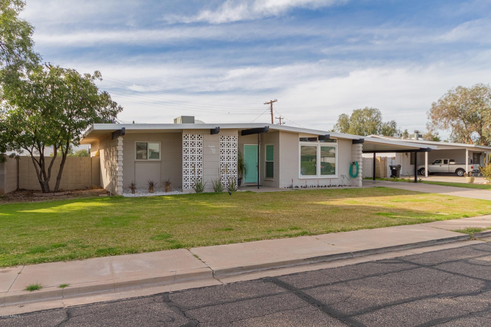 1732 North Queensbury Mesa, AZ 85201 - Photo 2 of 27 a front view of a house with a garden
