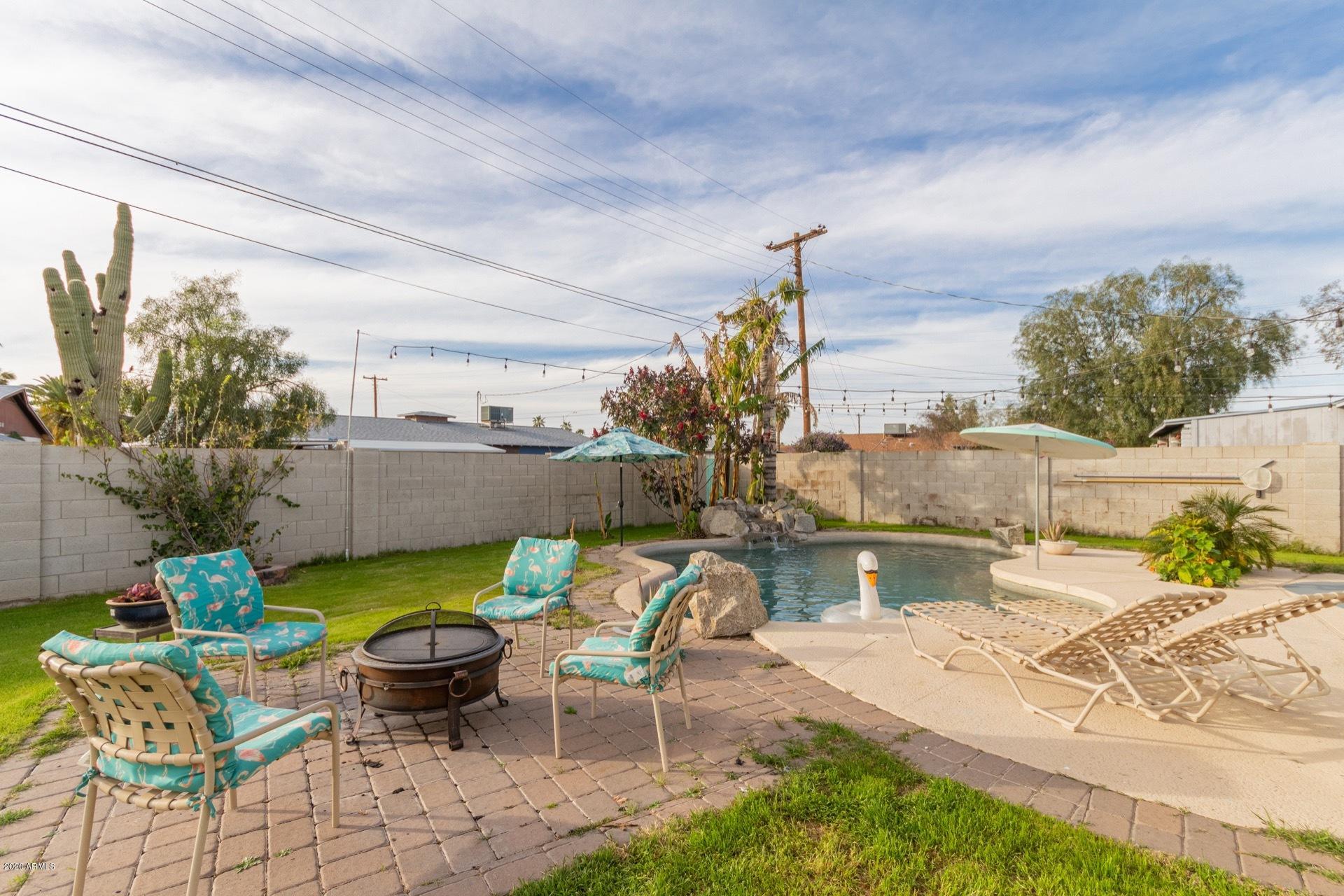 1732 North Queensbury Mesa, AZ 85201 - Photo 27 of 27 a view of swimming pool with outdoor seating and plants