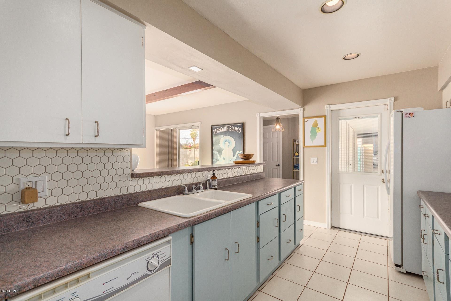 1732 North Queensbury Mesa, AZ 85201 - Photo 8 of 27 a kitchen with a sink and cabinets