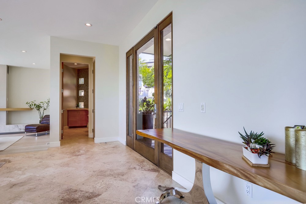 1725 Del Mar Avenue Laguna Beach, CA 92651 - Photo 17 of 63 a view of an entryway with wooden floor and a potted plant