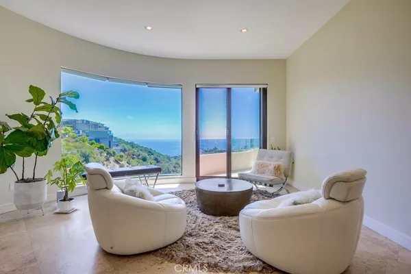 a view of a livingroom with furniture and window