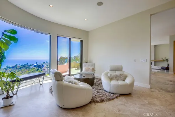 a living room with fireplace furniture and a wooden floor