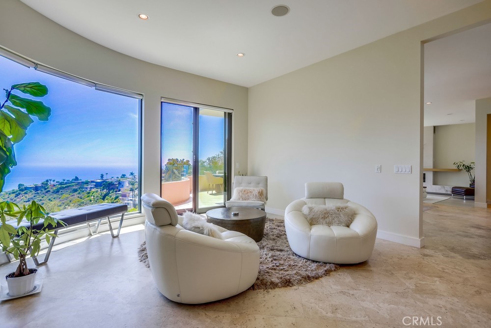 1725 Del Mar Avenue Laguna Beach, CA 92651 - Photo 19 of 63 a living room with furniture and a potted plant