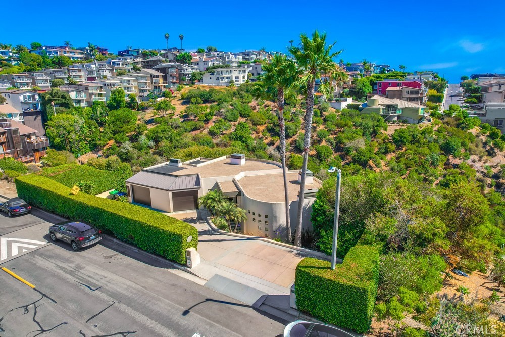1725 Del Mar Avenue Laguna Beach, CA 92651 - Photo 2 of 63 a green field with lots of trees in front of it